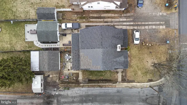 a buildings covered with tall trees