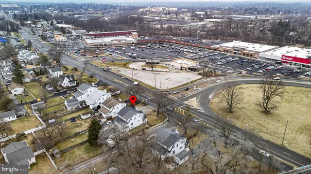 an aerial view of residential houses with outdoor space