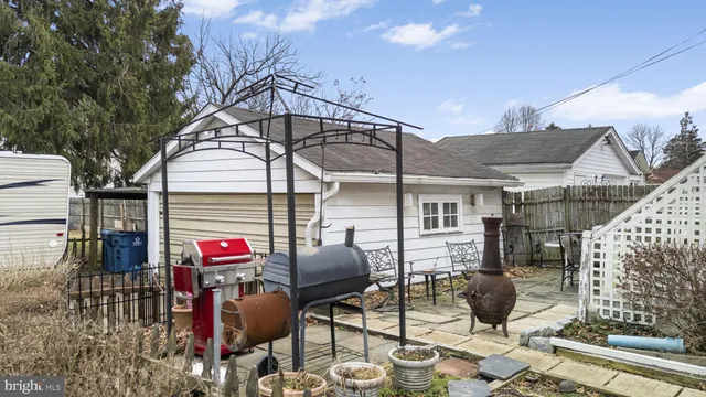 a front view of a house with sitting area