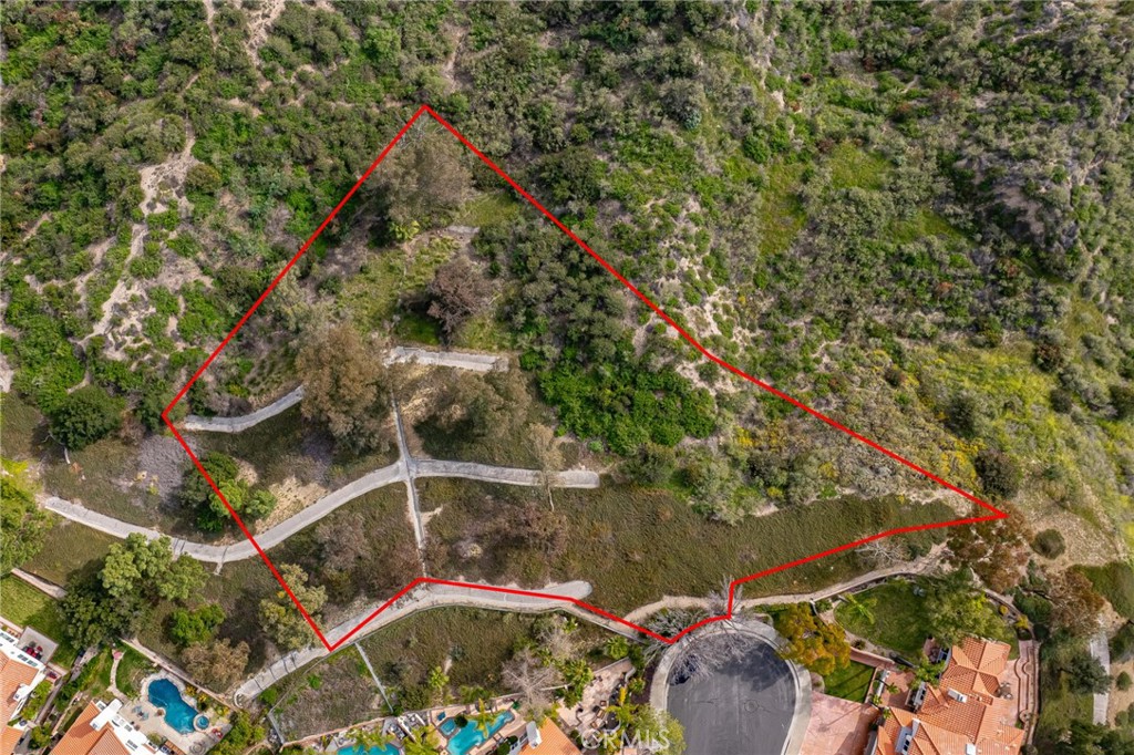 24910 Chicory Court Stevenson Ranch, CA 91381 - Photo 19 of 31 an aerial view of a house with a yard and large trees
