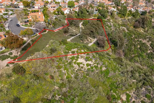an aerial view of a residential houses with outdoor space
