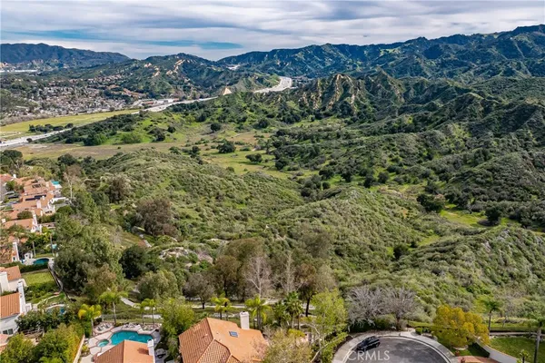 an aerial view of a houses with a yard
