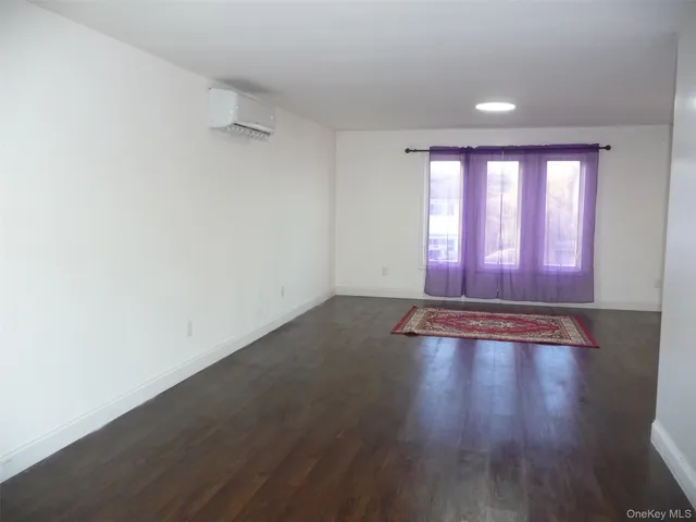 a bedroom with a bed and a shower