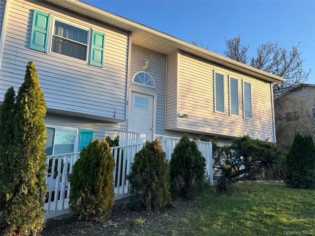 a kitchen with a sink cabinets and wooden floor