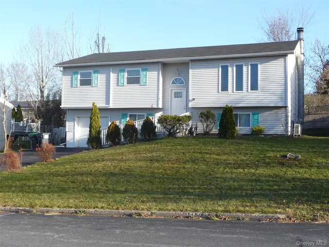 a view of room with window and hardwood floor
