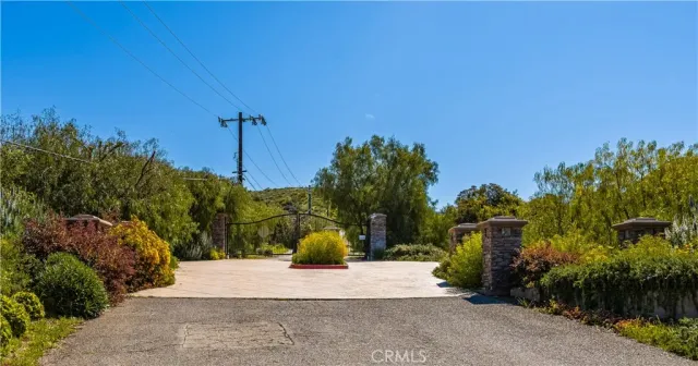 a view of a street with a building in the background