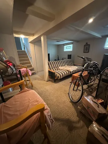 a bedroom with bed and a window