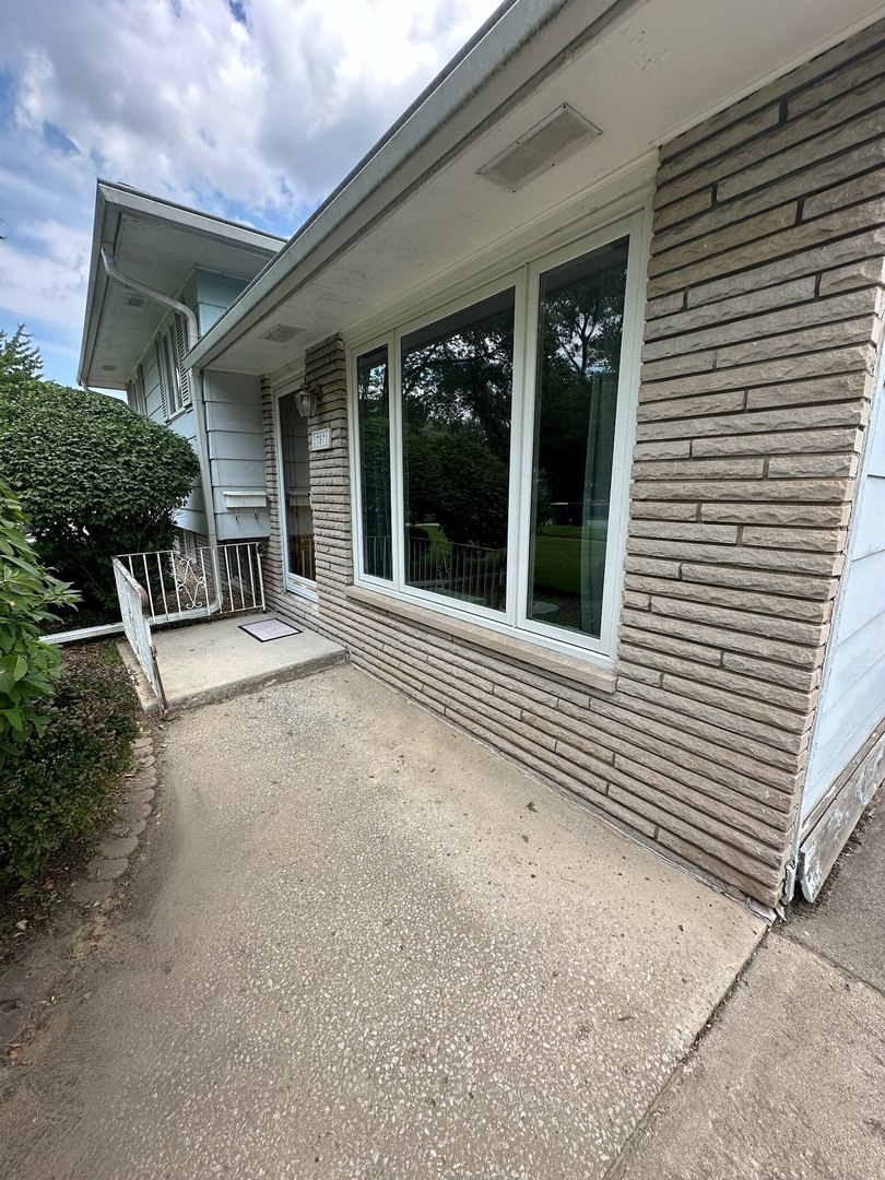 17871 Locust Street Lansing, IL 60438 - Photo 2 of 25 a view of a house with backyard and porch