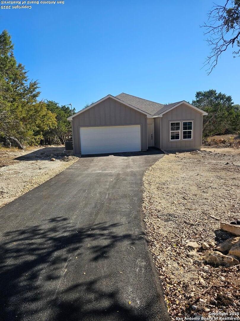 5250 Spring Branch Spring Branch, TX 78070 - Photo 1 of 23 a front view of a house with a yard