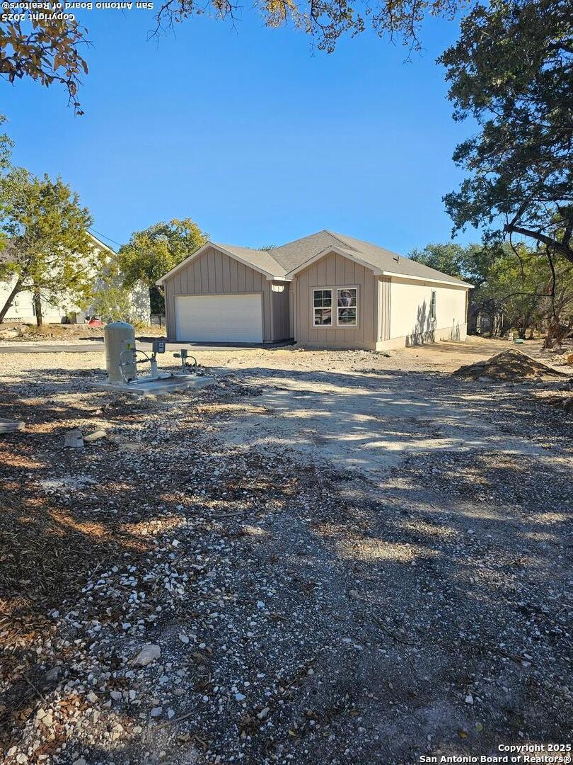 5250 Spring Branch Spring Branch, TX 78070 - Photo 2 of 23 a front view of a house with a yard