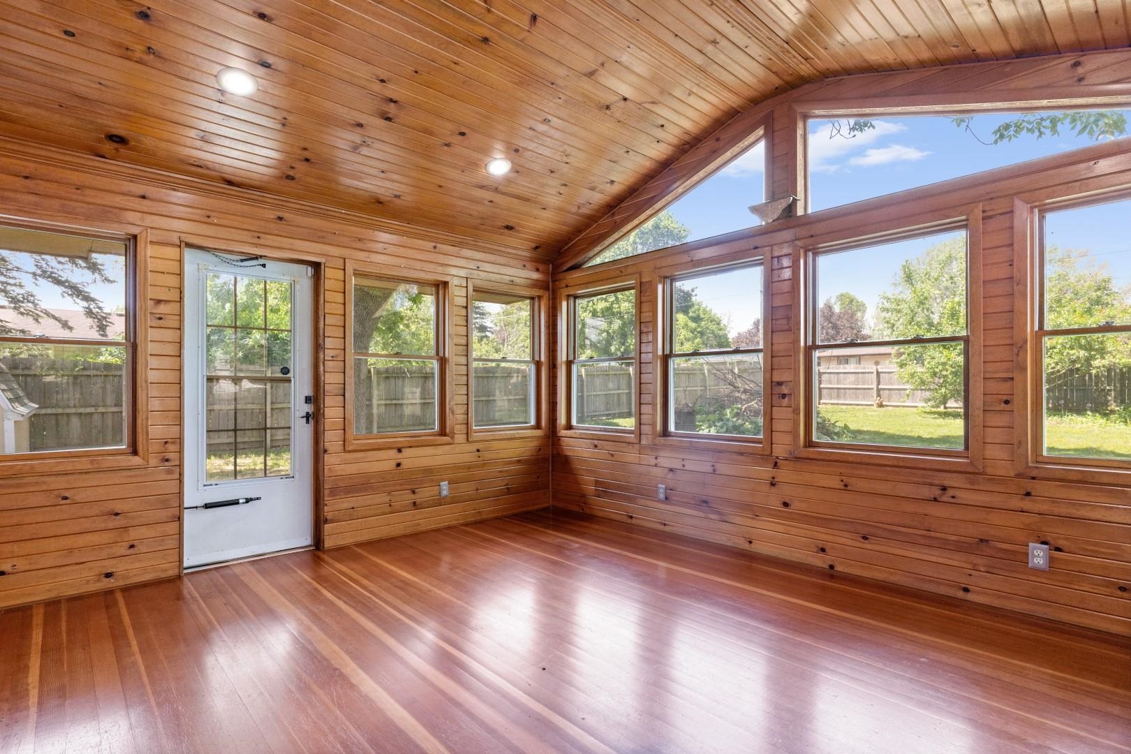 5864 Dover Road Rockford, IL 61109 - Photo 15 of 33 a view of an empty room with wooden floor and a window