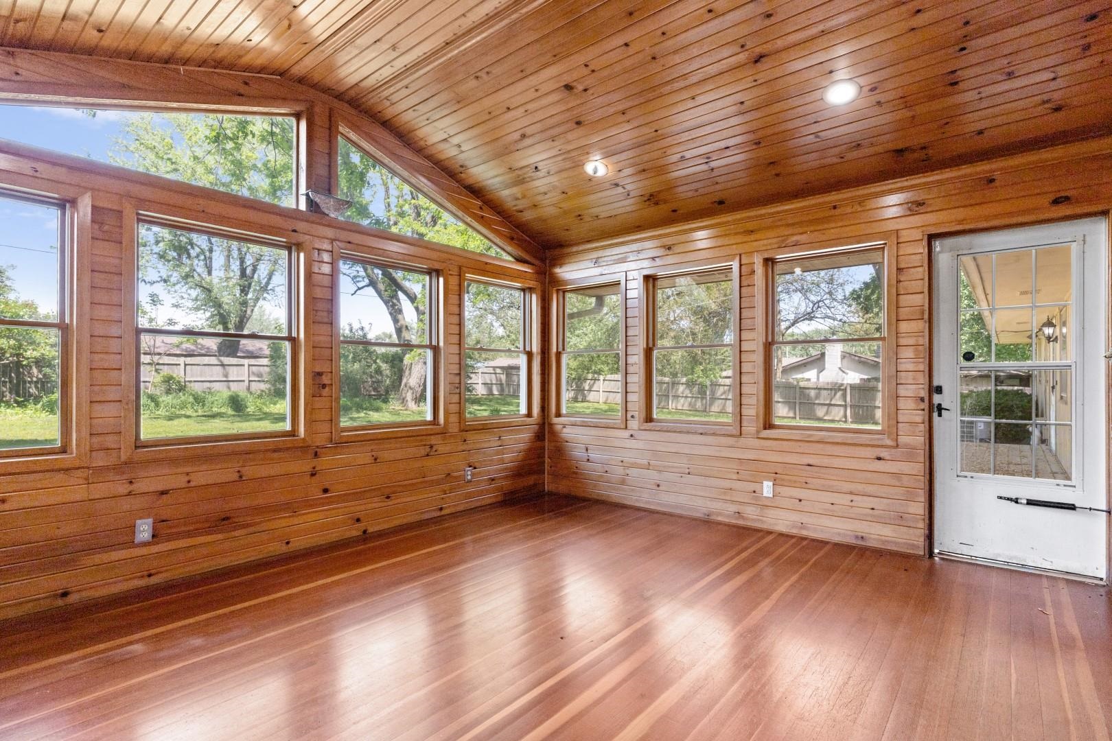 5864 Dover Road Rockford, IL 61109 - Photo 16 of 33 an empty room with wooden floor and windows
