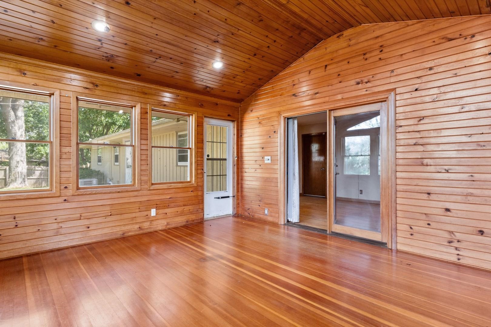 5864 Dover Road Rockford, IL 61109 - Photo 17 of 33 a view of an empty room with wooden floor and a window