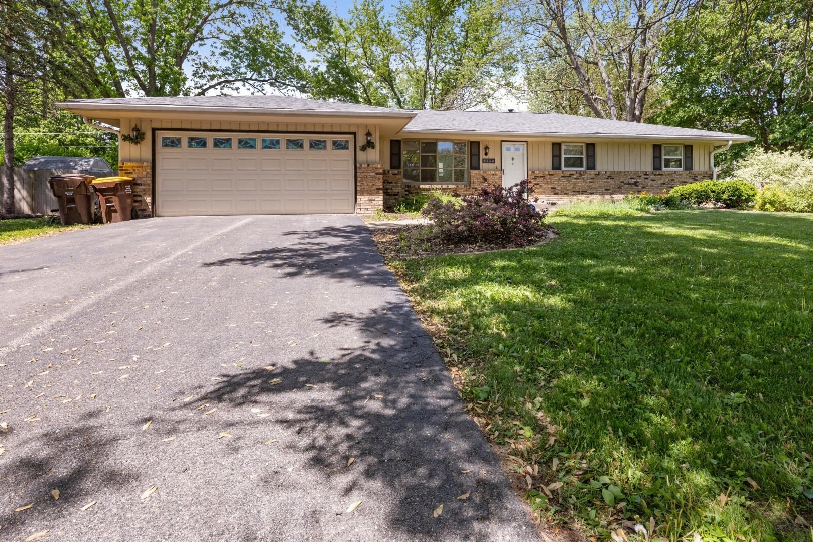 5864 Dover Road Rockford, IL 61109 - Photo 2 of 33 a front view of a house with garden