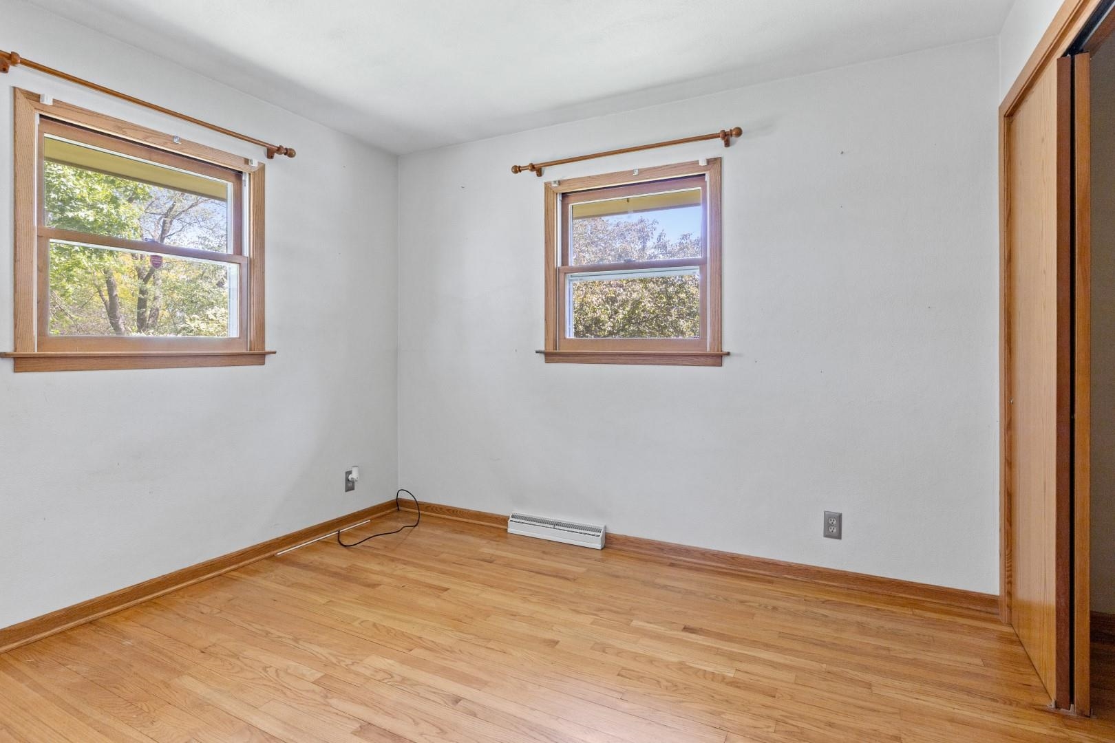 5864 Dover Road Rockford, IL 61109 - Photo 21 of 33 a view of an empty room with wooden floor and a window