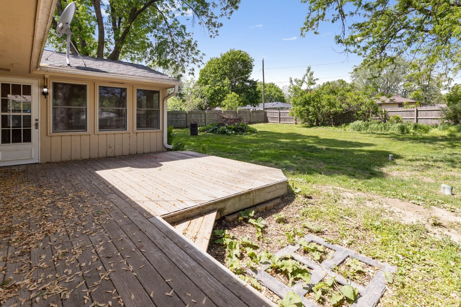 5864 Dover Road Rockford, IL 61109 - Photo 27 of 33 a view of a backyard with a garden and plants