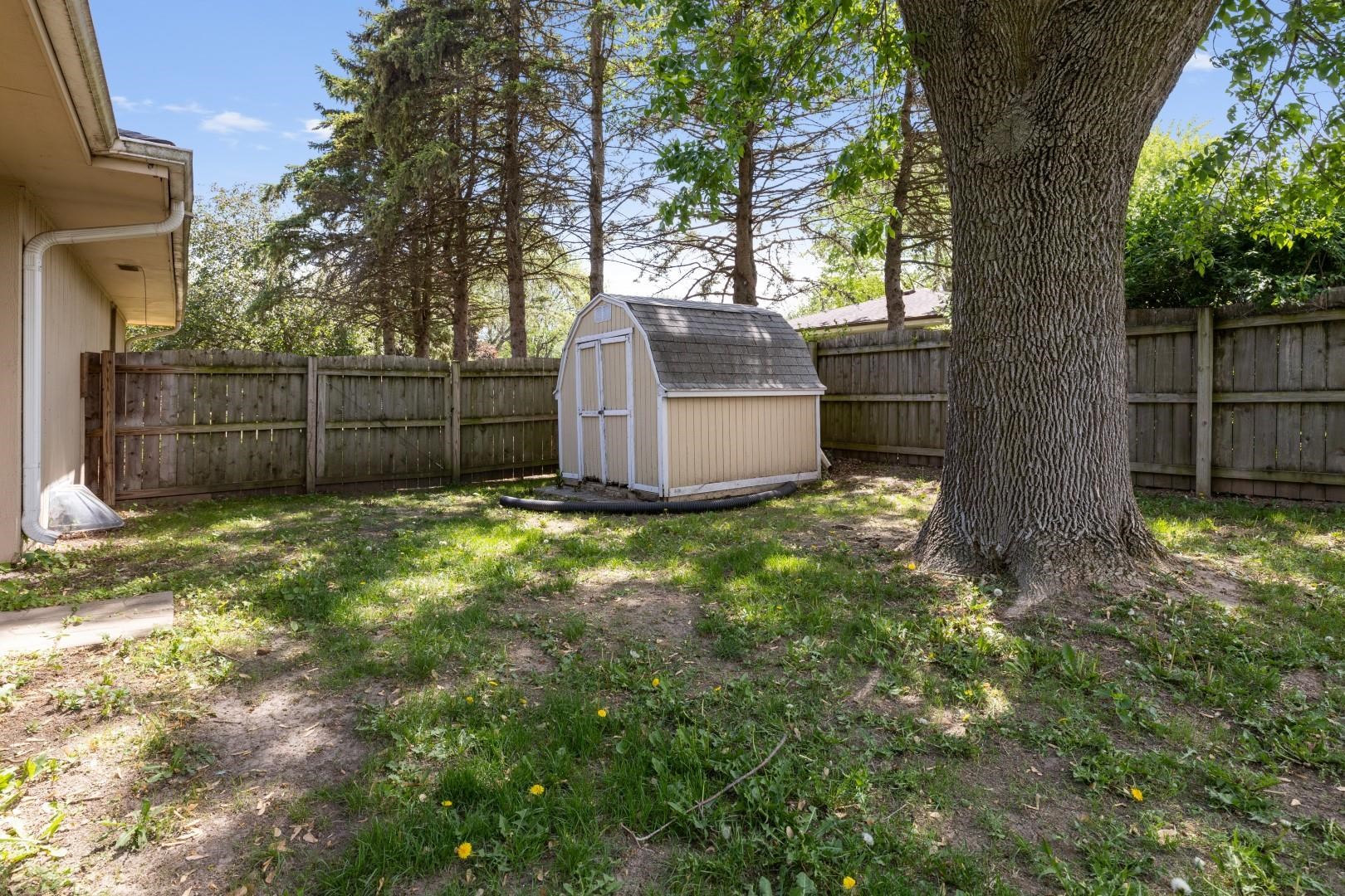 5864 Dover Road Rockford, IL 61109 - Photo 30 of 33 a view of backyard with tree