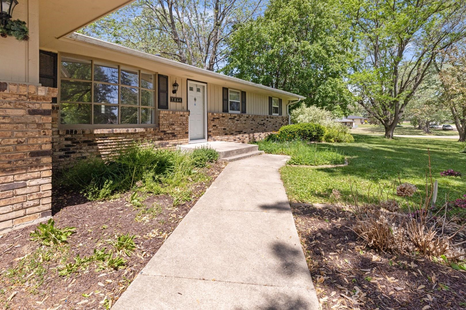 5864 Dover Road Rockford, IL 61109 - Photo 3 of 33 a front view of a house with garden