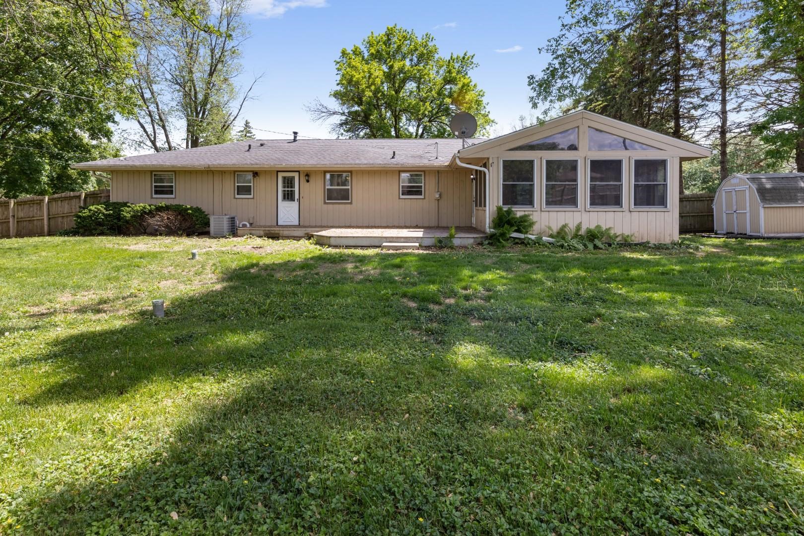 5864 Dover Road Rockford, IL 61109 - Photo 31 of 33 a front view of a house with a yard table and chairs