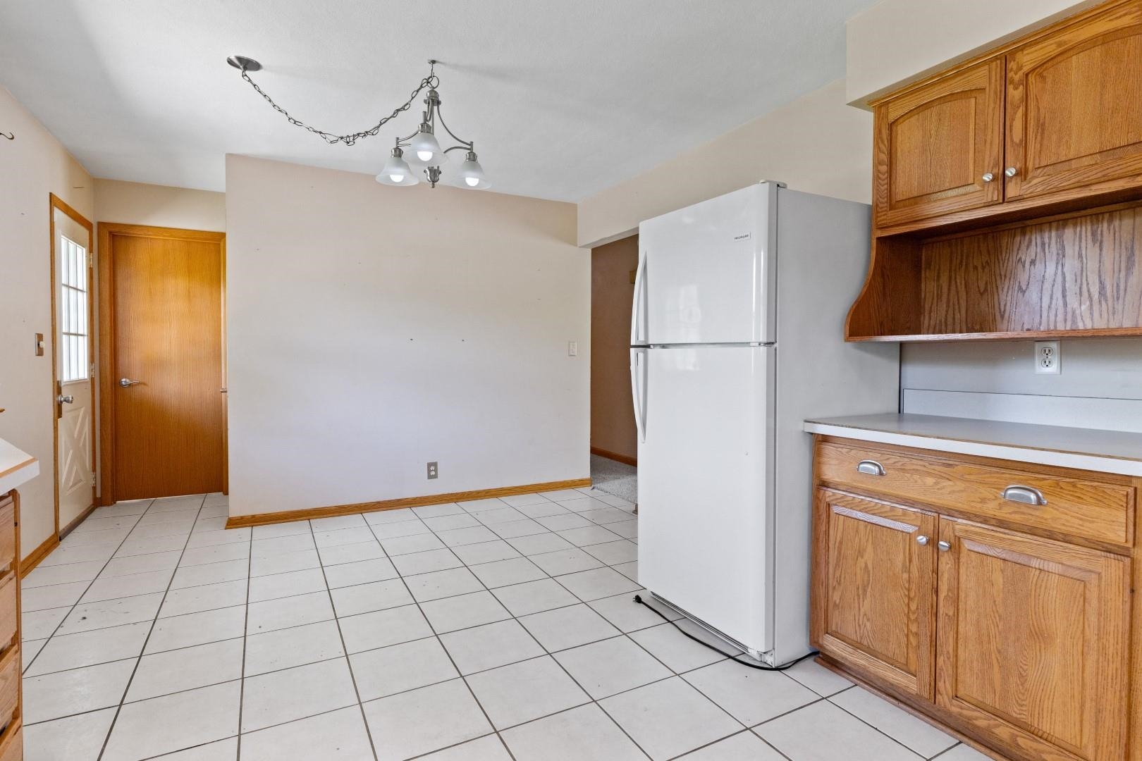 5864 Dover Road Rockford, IL 61109 - Photo 8 of 33 a view of a kitchen with refrigerator and cabinets