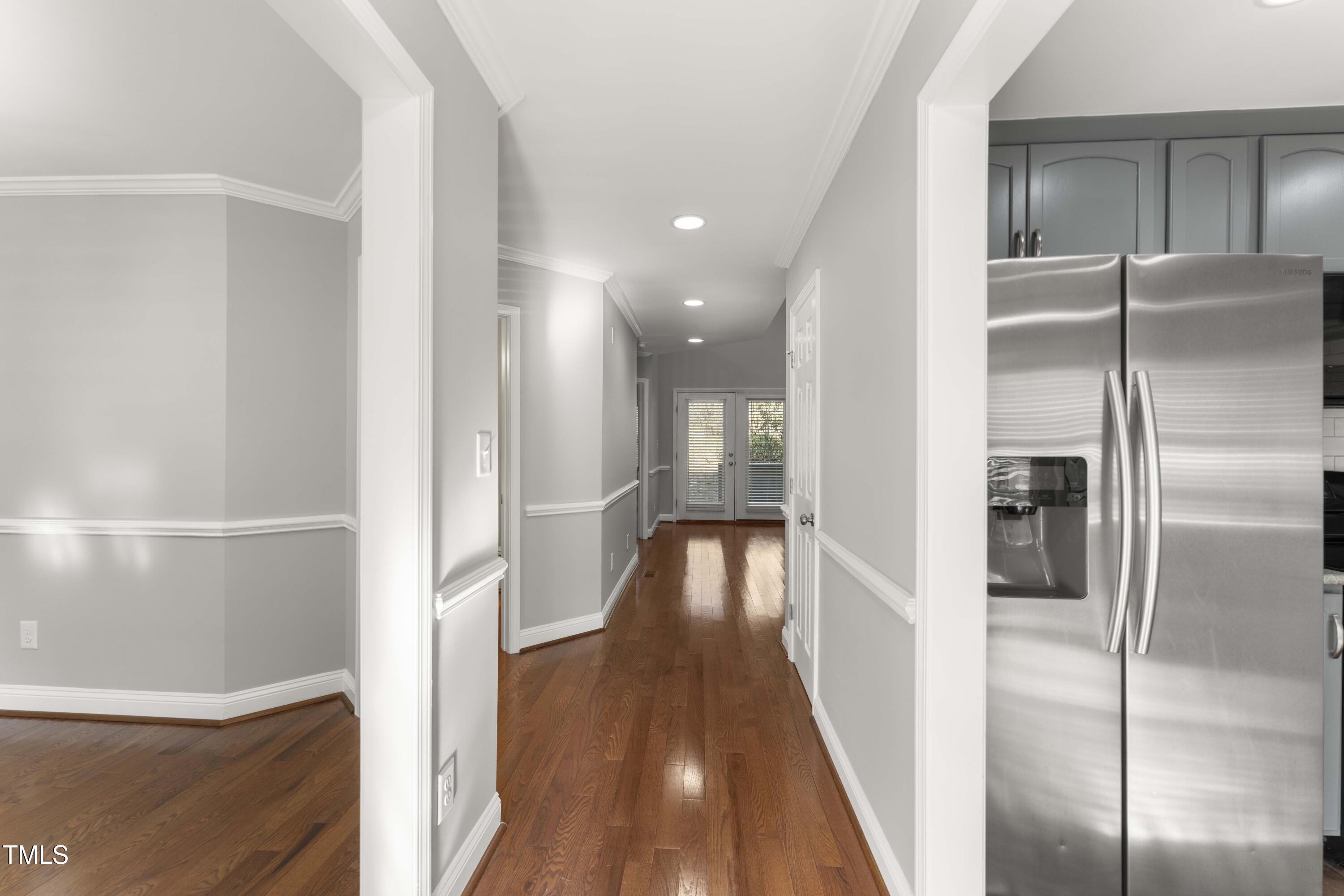 1426 Quarter Point Raleigh, NC 27615 - Photo 17 of 64 a view of hallway with wooden floor