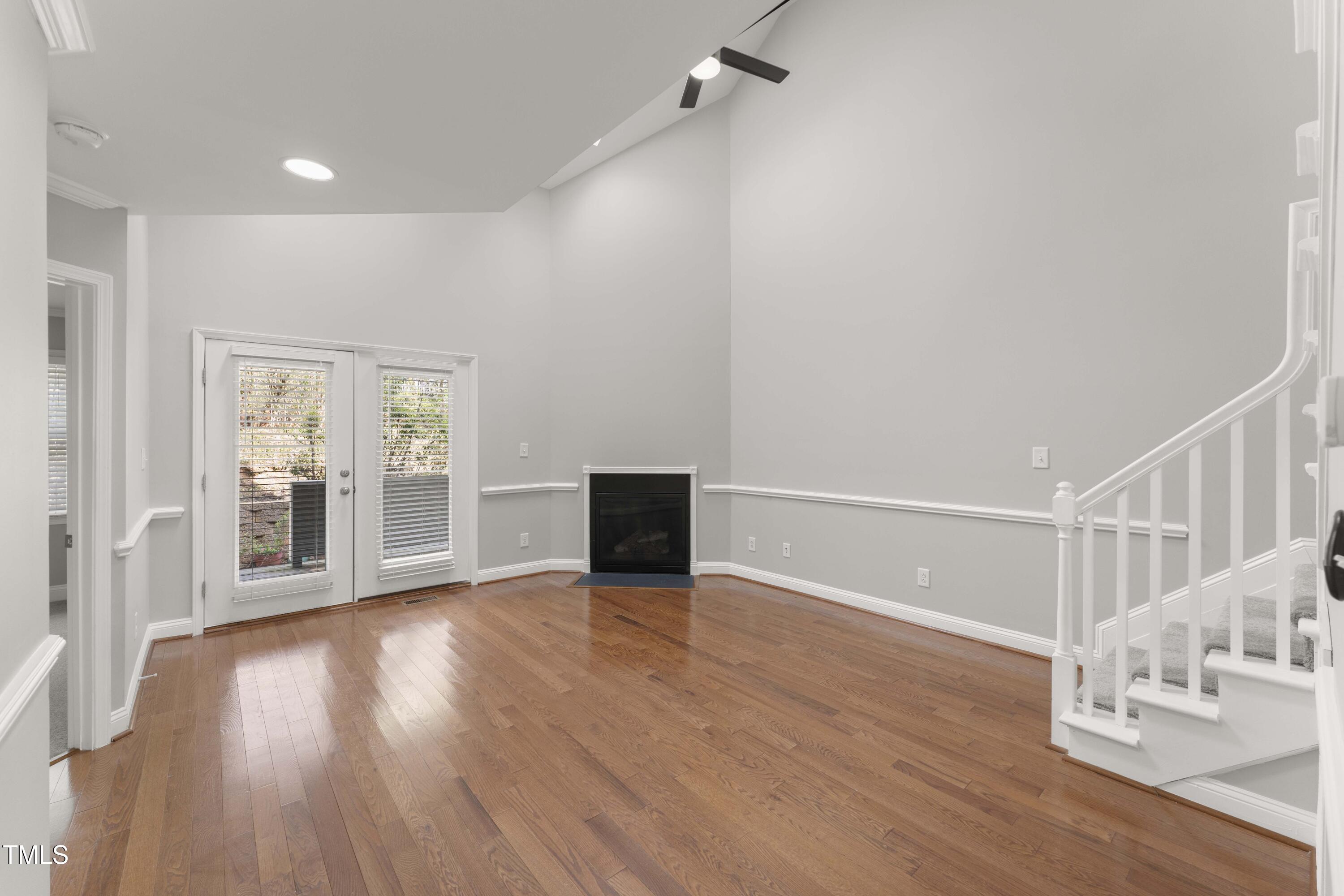 1426 Quarter Point Raleigh, NC 27615 - Photo 3 of 64 a view of an empty room with wooden floor and a window