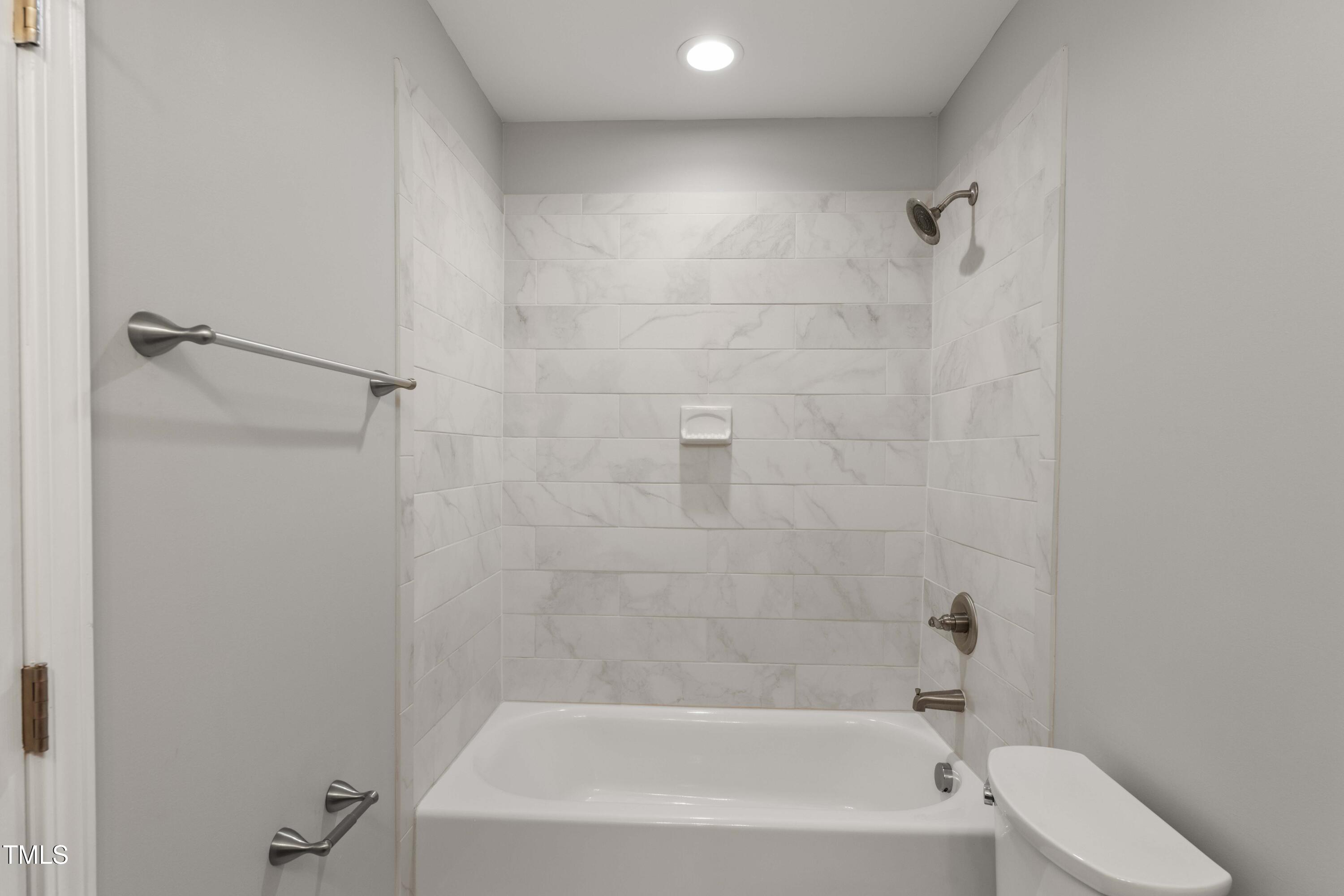 1426 Quarter Point Raleigh, NC 27615 - Photo 41 of 64 a bathroom with a bathtub
