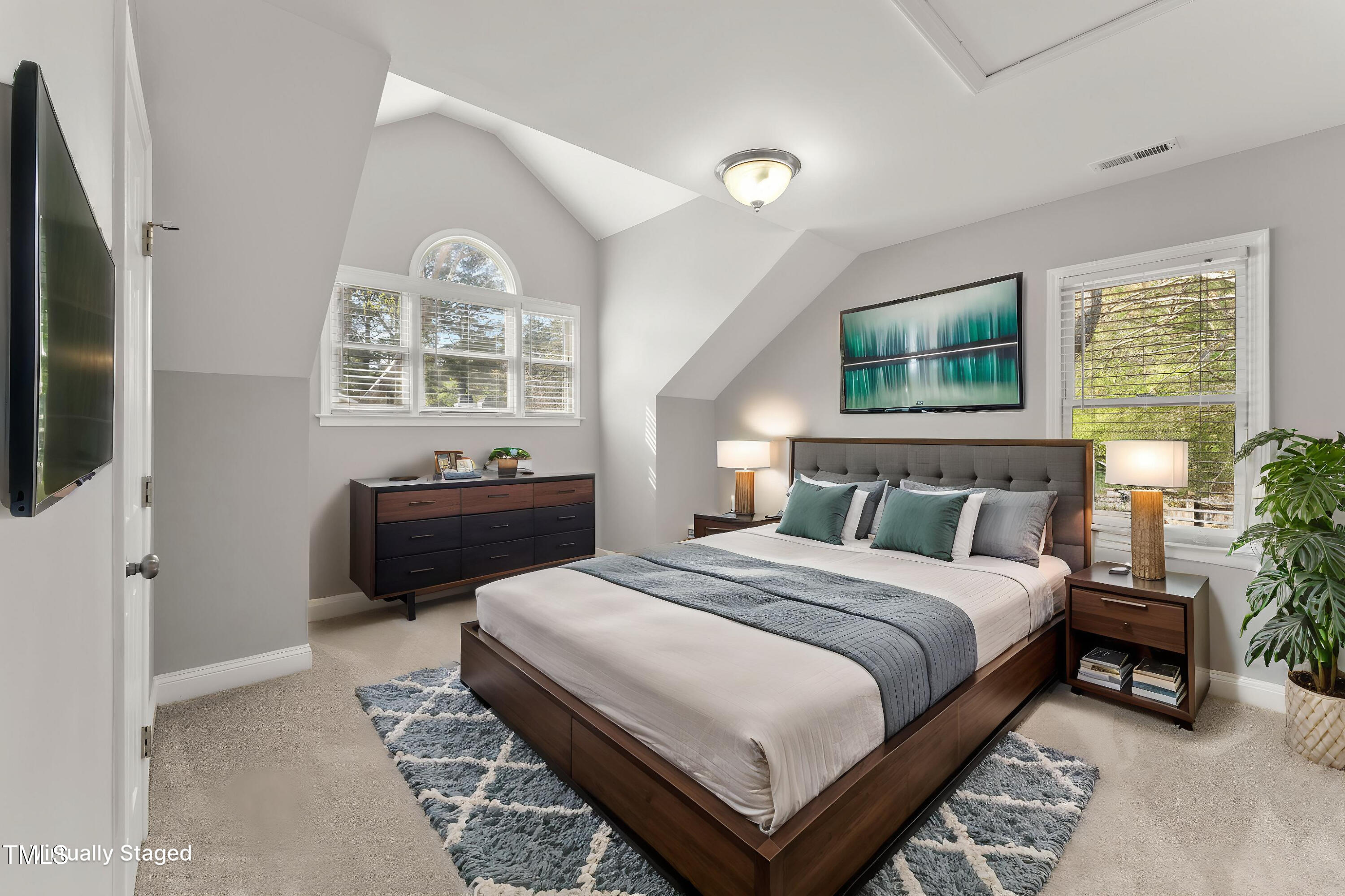 1426 Quarter Point Raleigh, NC 27615 - Photo 4 of 64 a bedroom with a bed and a flat screen tv