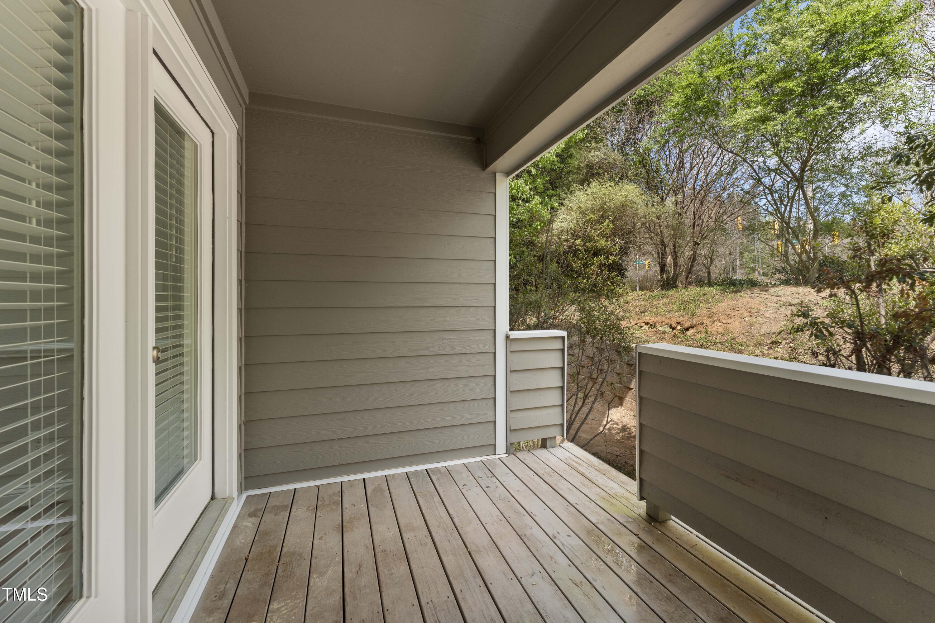 1426 Quarter Point Raleigh, NC 27615 - Photo 51 of 64 a view of a balcony with wooden floor