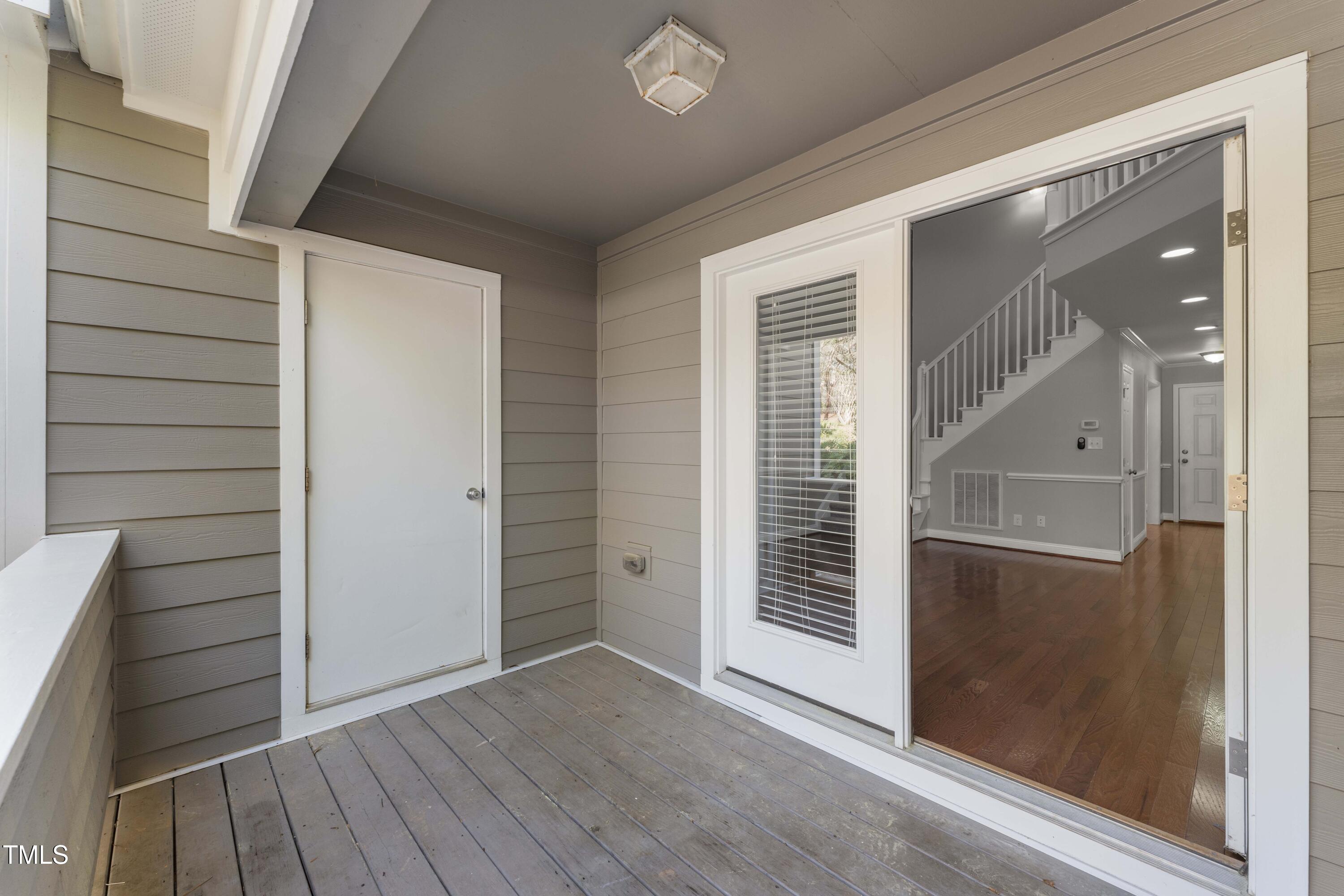 1426 Quarter Point Raleigh, NC 27615 - Photo 52 of 64 wooden floor and window in an empty room
