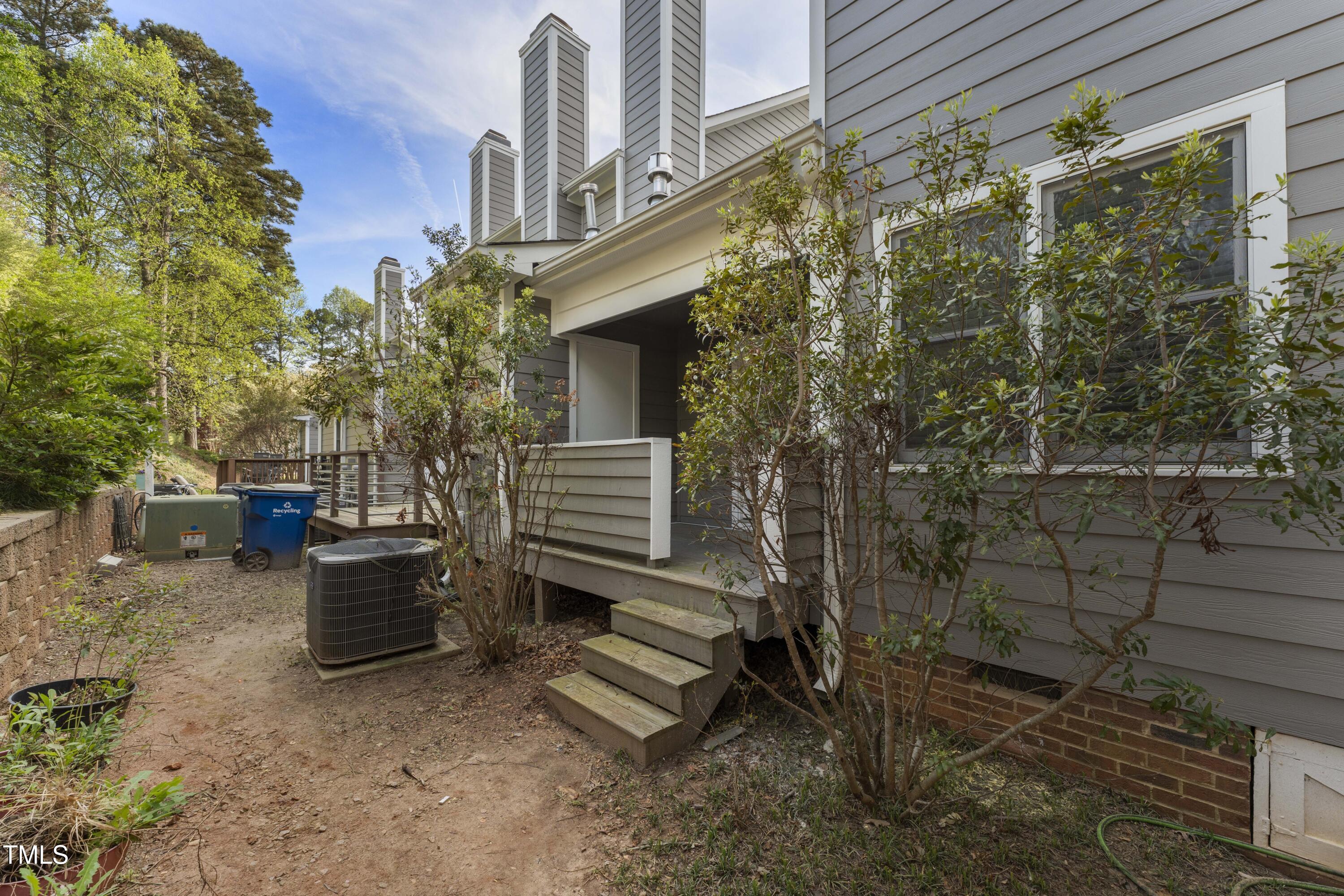 1426 Quarter Point Raleigh, NC 27615 - Photo 53 of 64 a view of a patio with table and chairs and potted plants