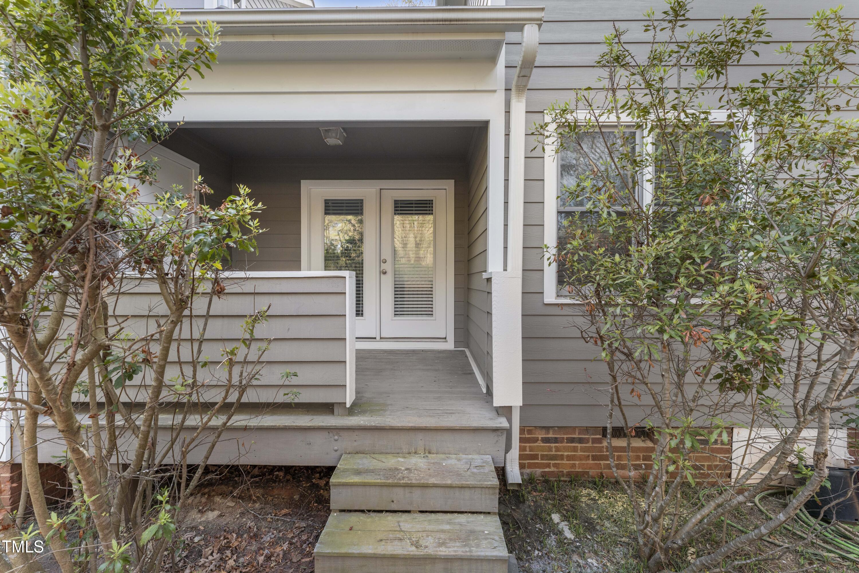 1426 Quarter Point Raleigh, NC 27615 - Photo 54 of 64 a front view of a house with a garden
