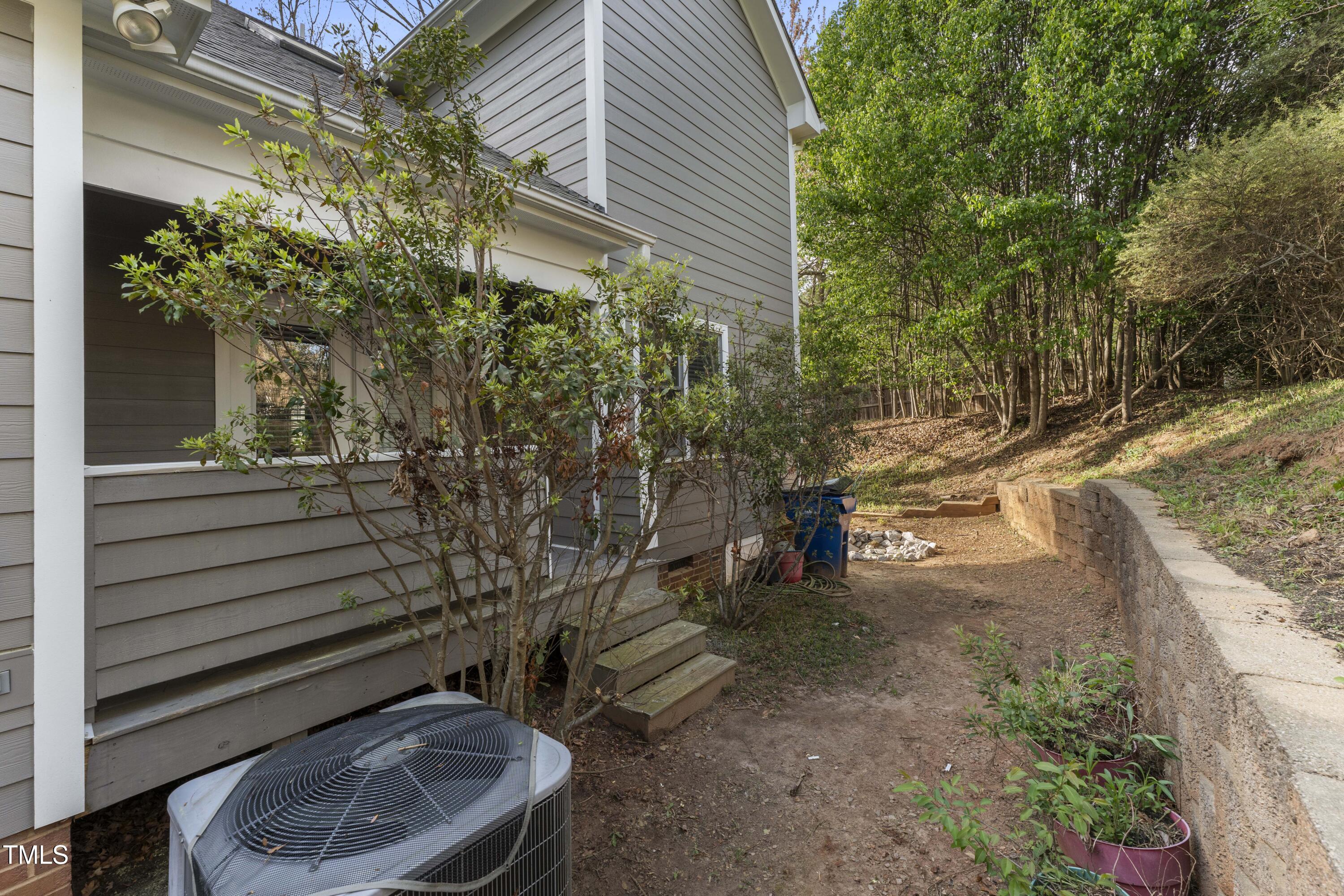1426 Quarter Point Raleigh, NC 27615 - Photo 55 of 64 a view of a house with a backyard