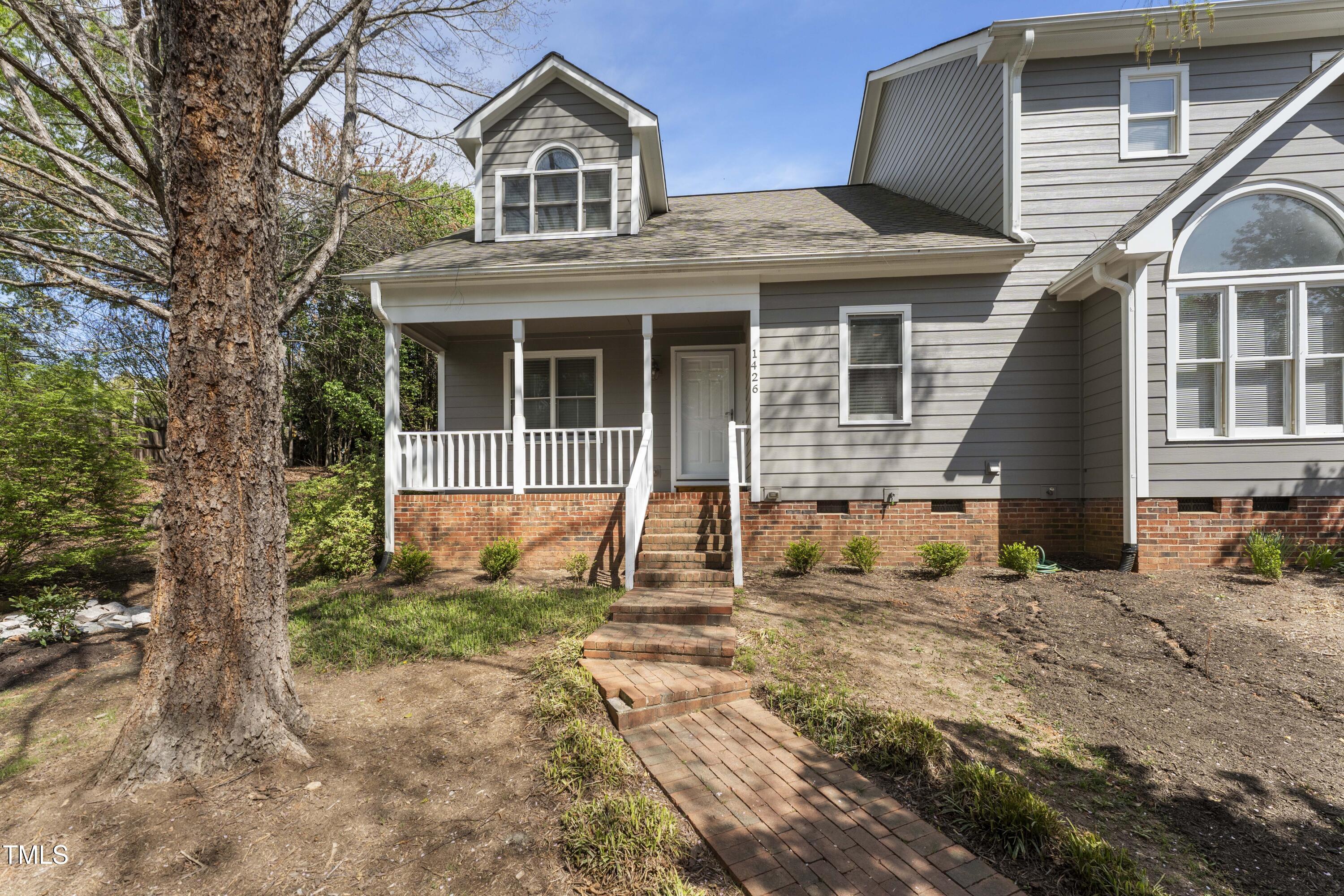 1426 Quarter Point Raleigh, NC 27615 - Photo 58 of 64 a front view of a house with a yard