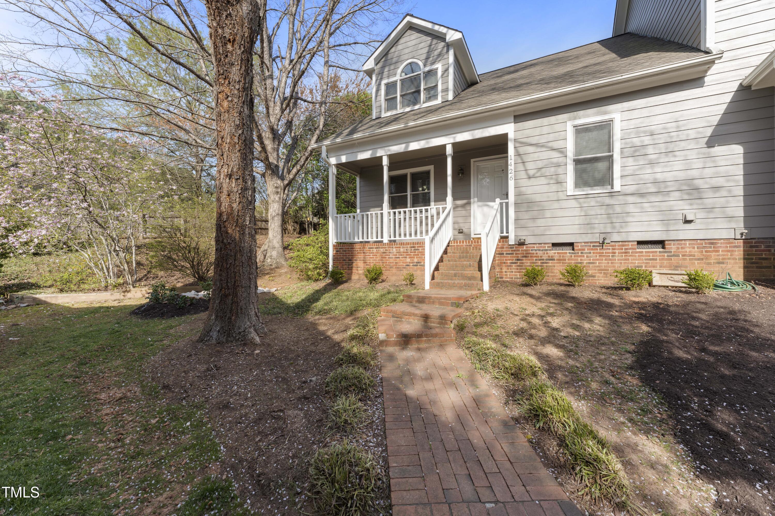 1426 Quarter Point Raleigh, NC 27615 - Photo 60 of 64 a house view with a backyard space