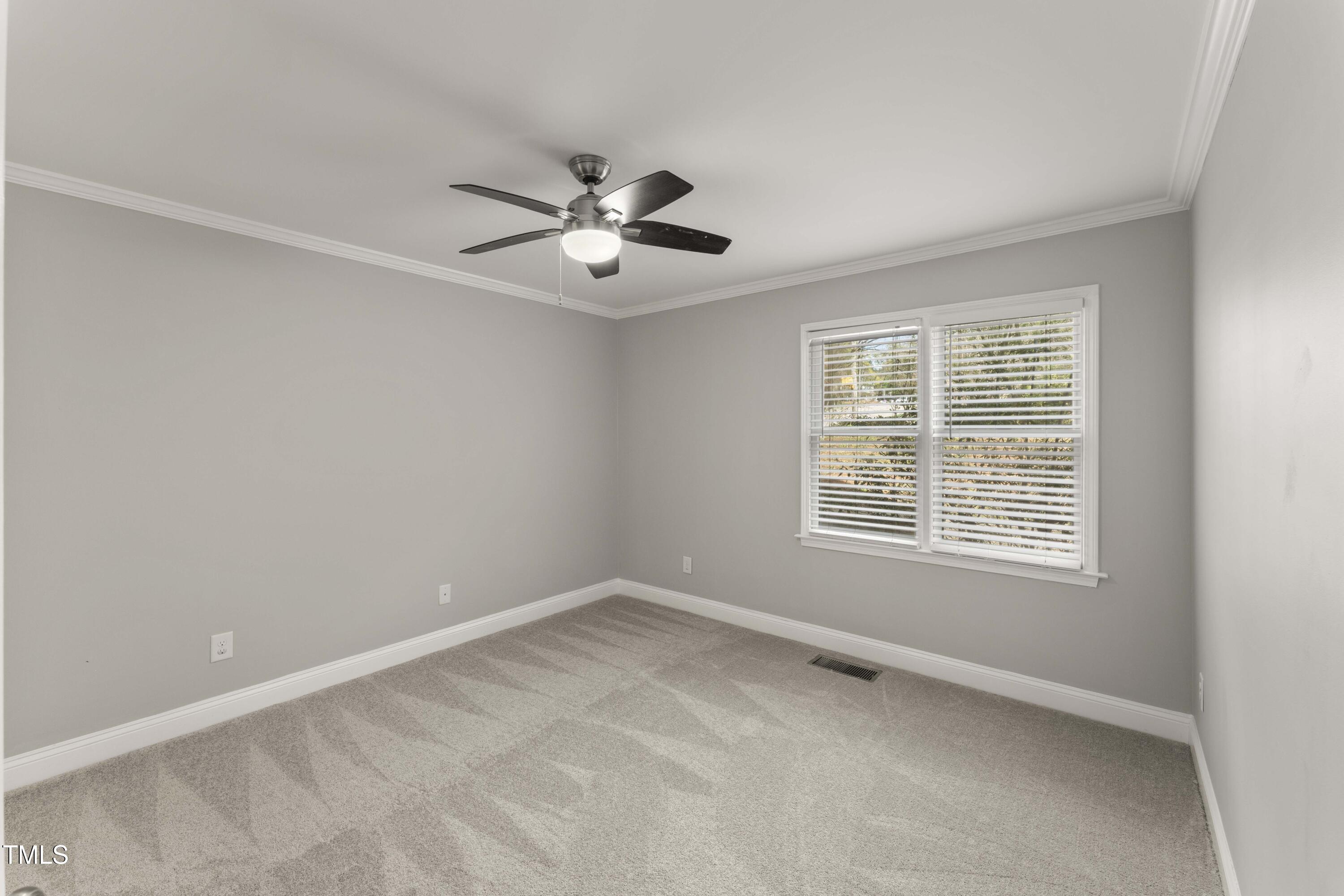 1426 Quarter Point Raleigh, NC 27615 - Photo 7 of 64 a view of an empty room with a window
