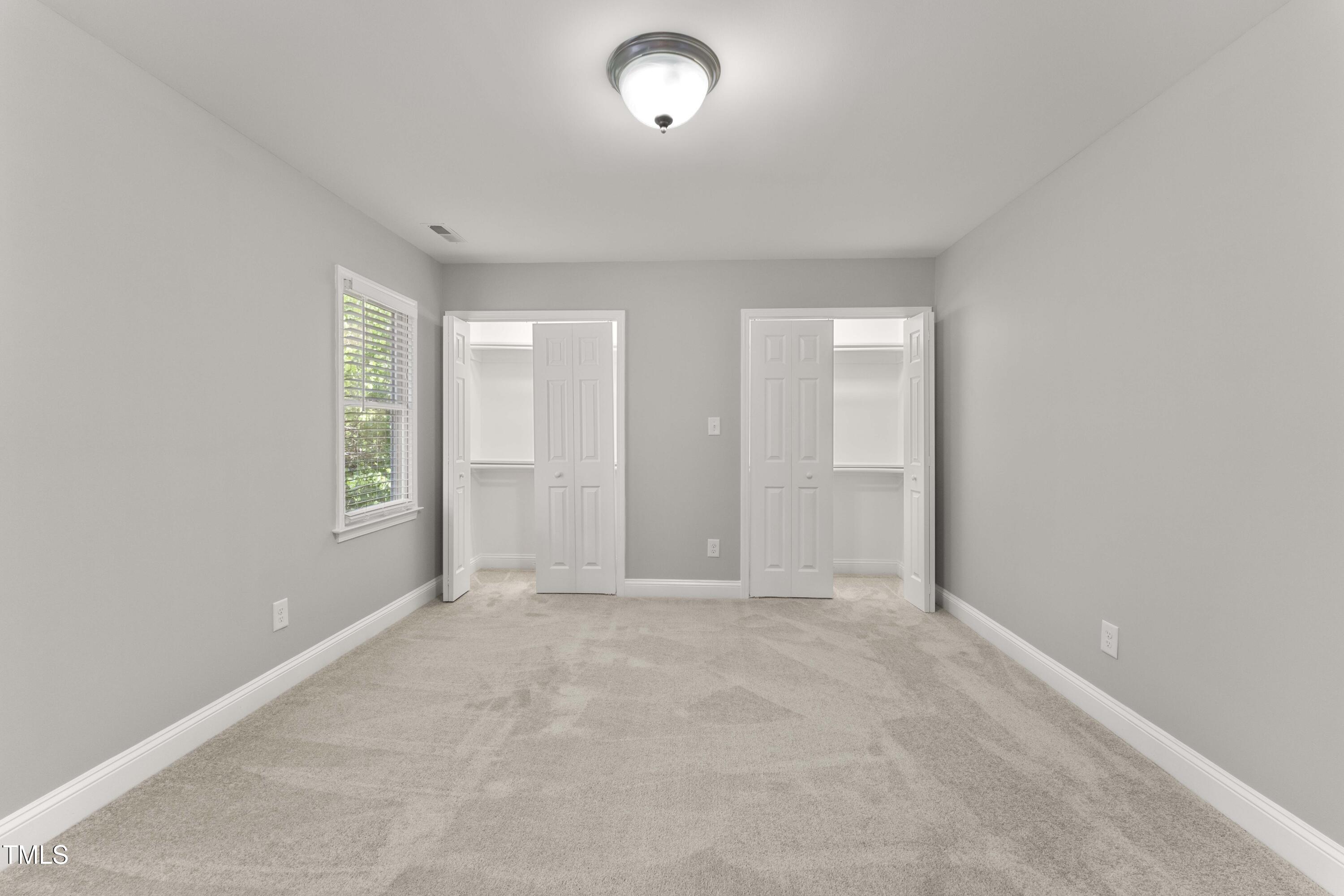 1426 Quarter Point Raleigh, NC 27615 - Photo 9 of 64 an empty room with windows and closet