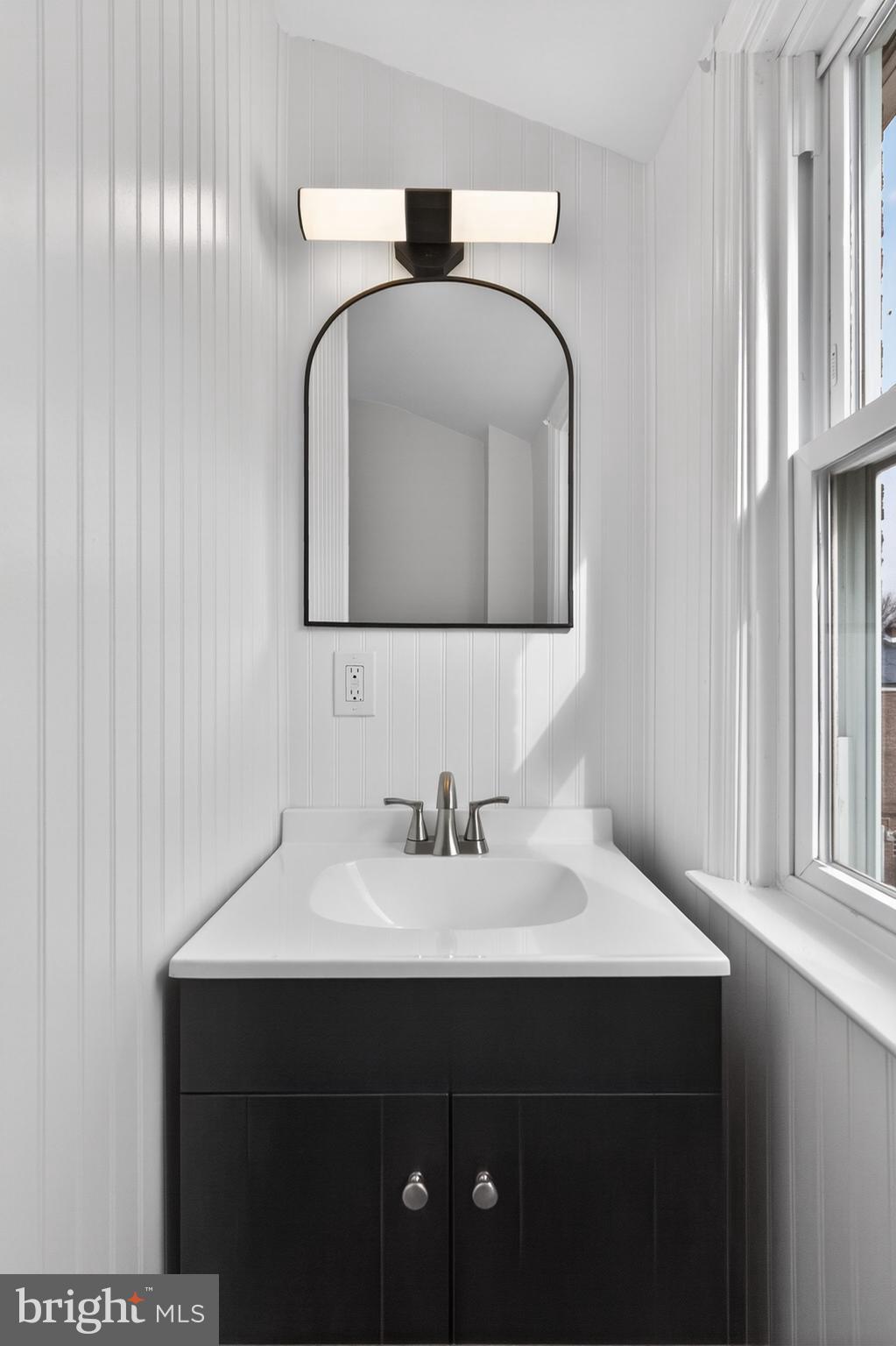 1311 Spring Street Sharon Hill, PA 19079 - Photo 12 of 21 a bathroom with a sink and a mirror