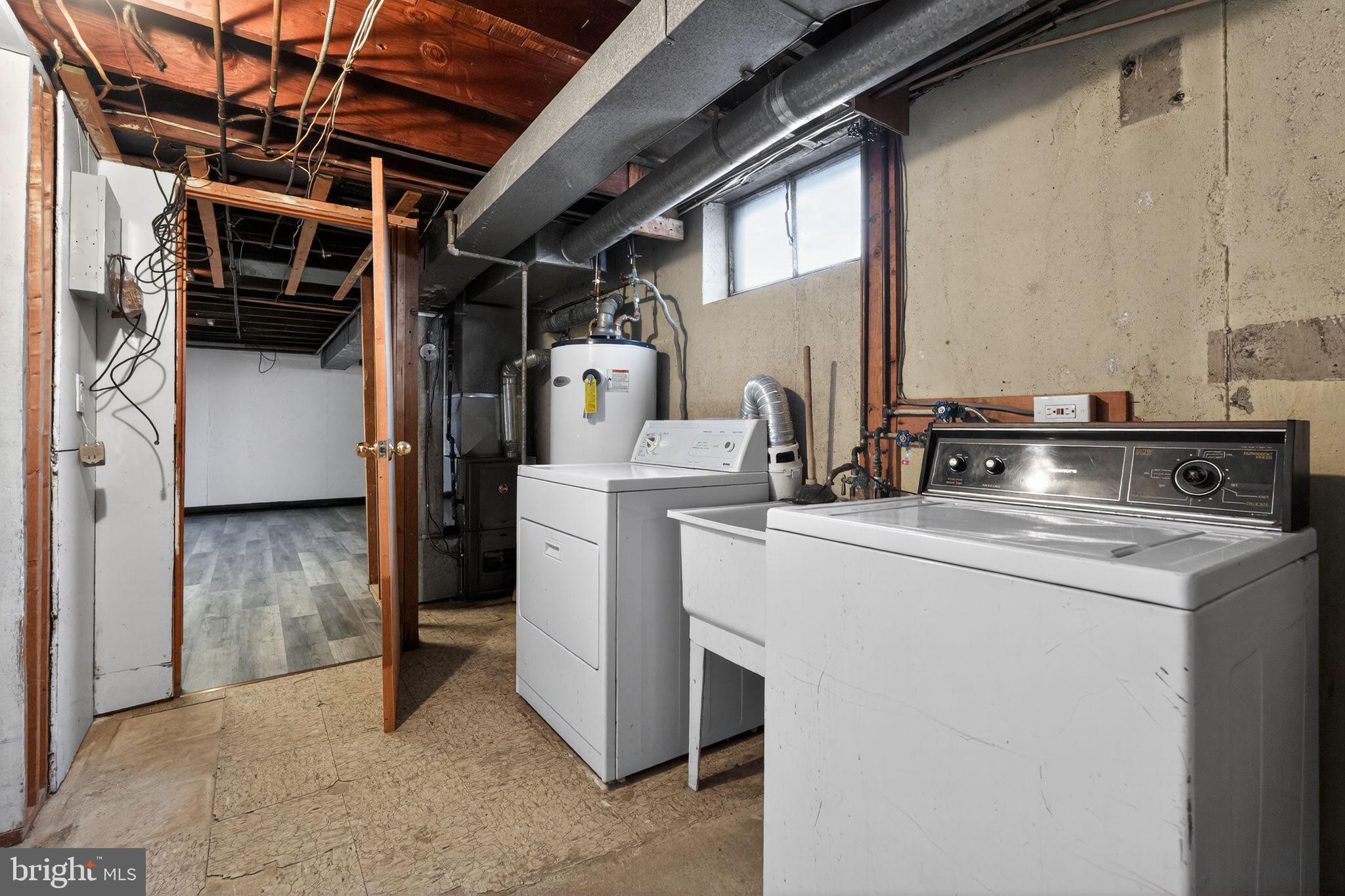 1311 Spring Street Sharon Hill, PA 19079 - Photo 17 of 21 a utility room with dryer and washer