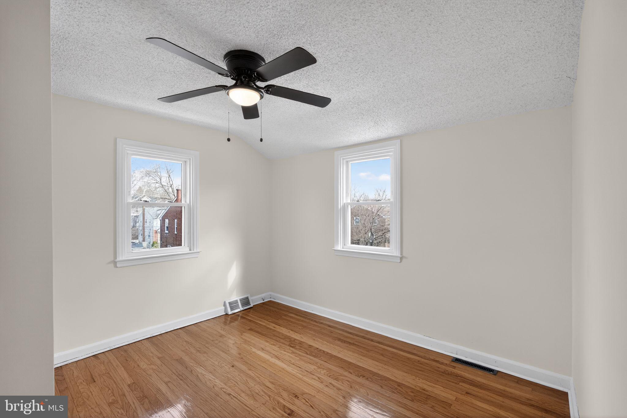 1311 Spring Street Sharon Hill, PA 19079 - Photo 8 of 21 a view of empty room with wooden floor