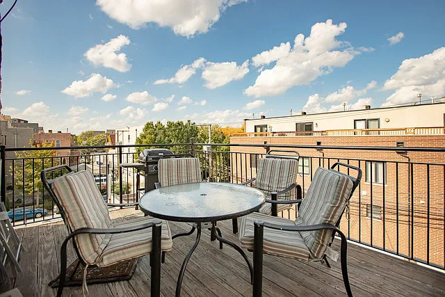 2054 West Division Street, Unit 3 Chicago, IL 60622 - Photo 15 of 15 a view of a balcony with a table and chairs