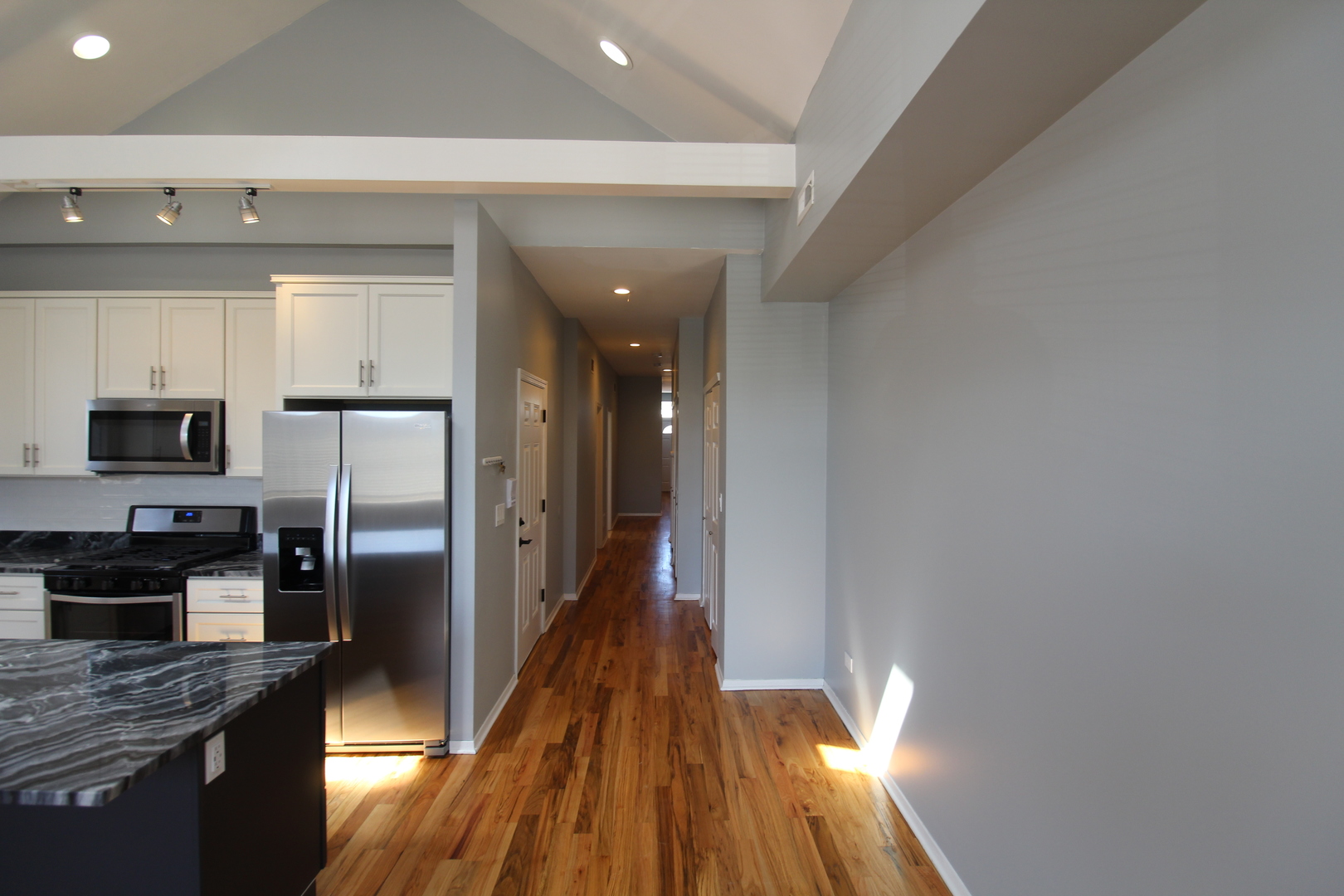 2054 West Division Street, Unit 3 Chicago, IL 60622 - Photo 5 of 15 a kitchen with a refrigerator and a stove top oven