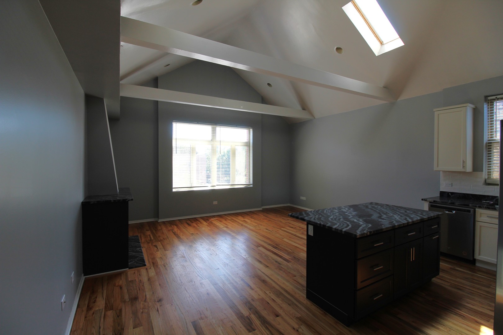 2054 West Division Street, Unit 3 Chicago, IL 60622 - Photo 6 of 15 a bedroom with a bed and wooden floor