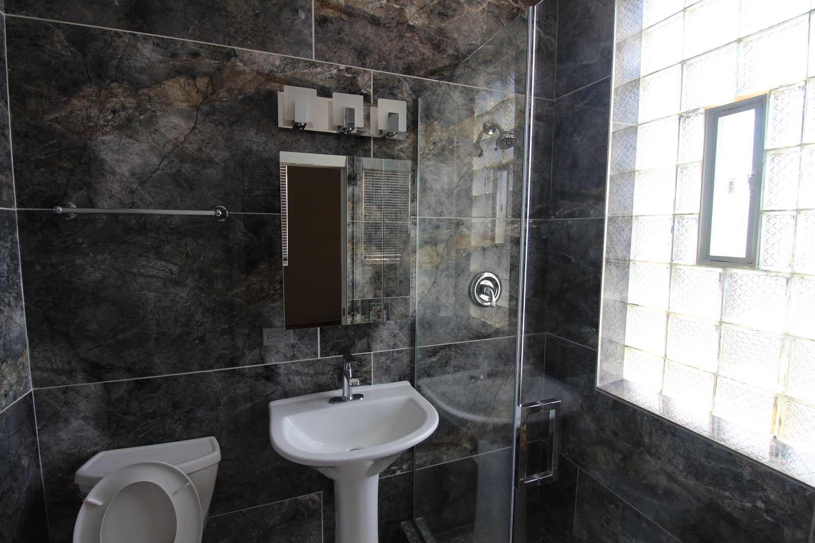 2054 West Division Street, Unit 3 Chicago, IL 60622 - Photo 10 of 15 a bathroom with a sink toilet and shower