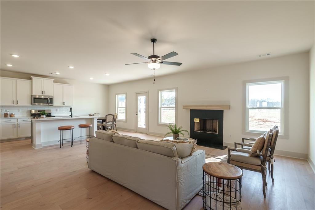 222 Good Hope Preserve Good Hope, GA 30641 - Photo 12 of 46 a living room with furniture and fireplace