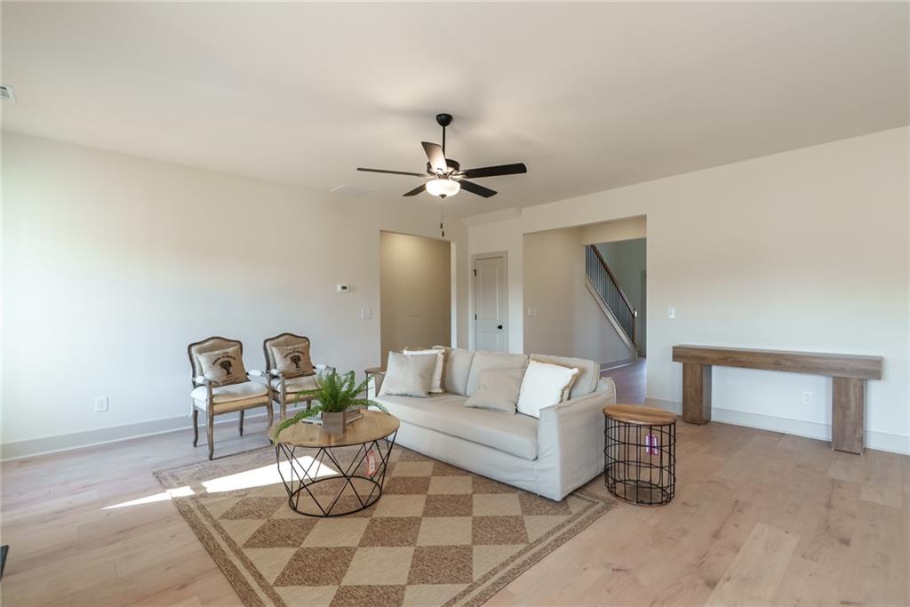 222 Good Hope Preserve Good Hope, GA 30641 - Photo 14 of 46 a living room with furniture and a chandelier