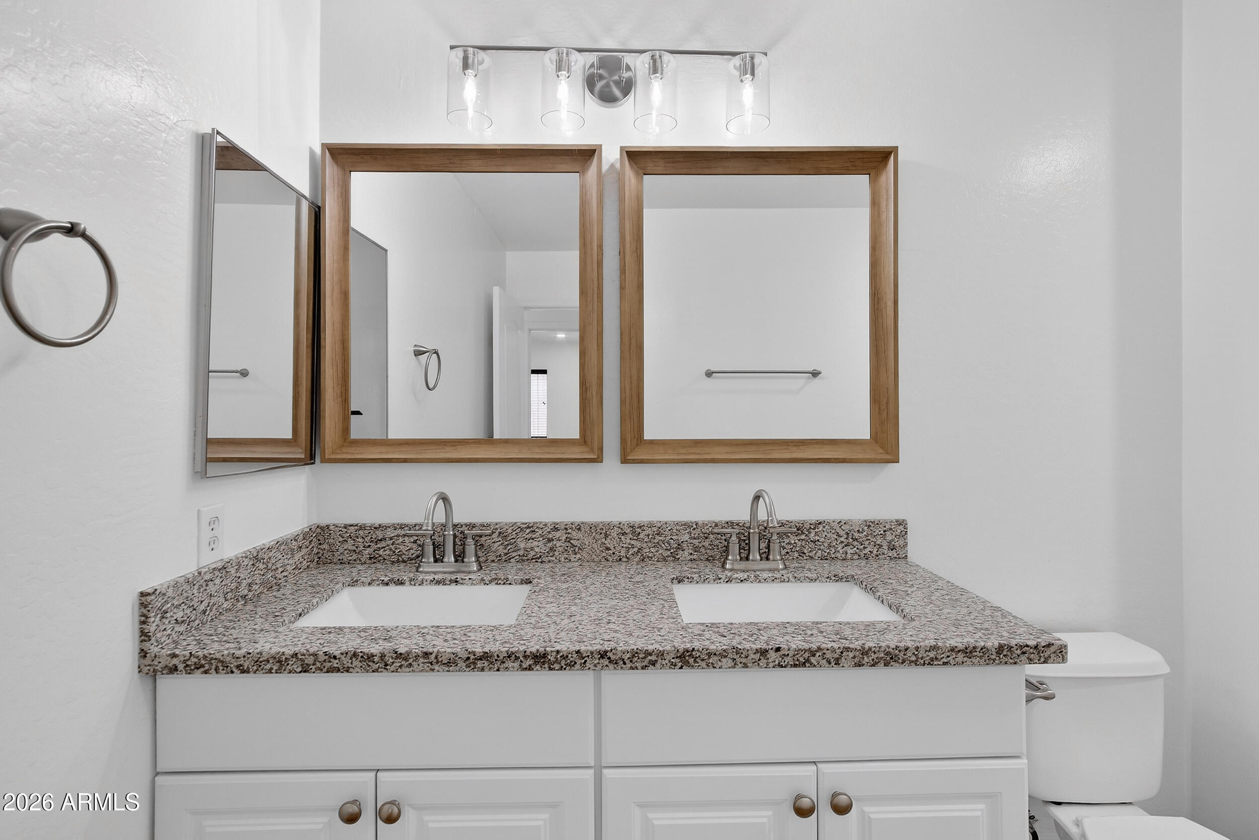 43620 West Cowpath Road Maricopa, AZ 85138 - Photo 49 of 60 a bathroom with a granite countertop sink and a mirror