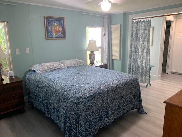 918 South Ruby Drive Key Largo, FL 33037 - Photo 30 of 57 a bed sitting in a bedroom next to a window