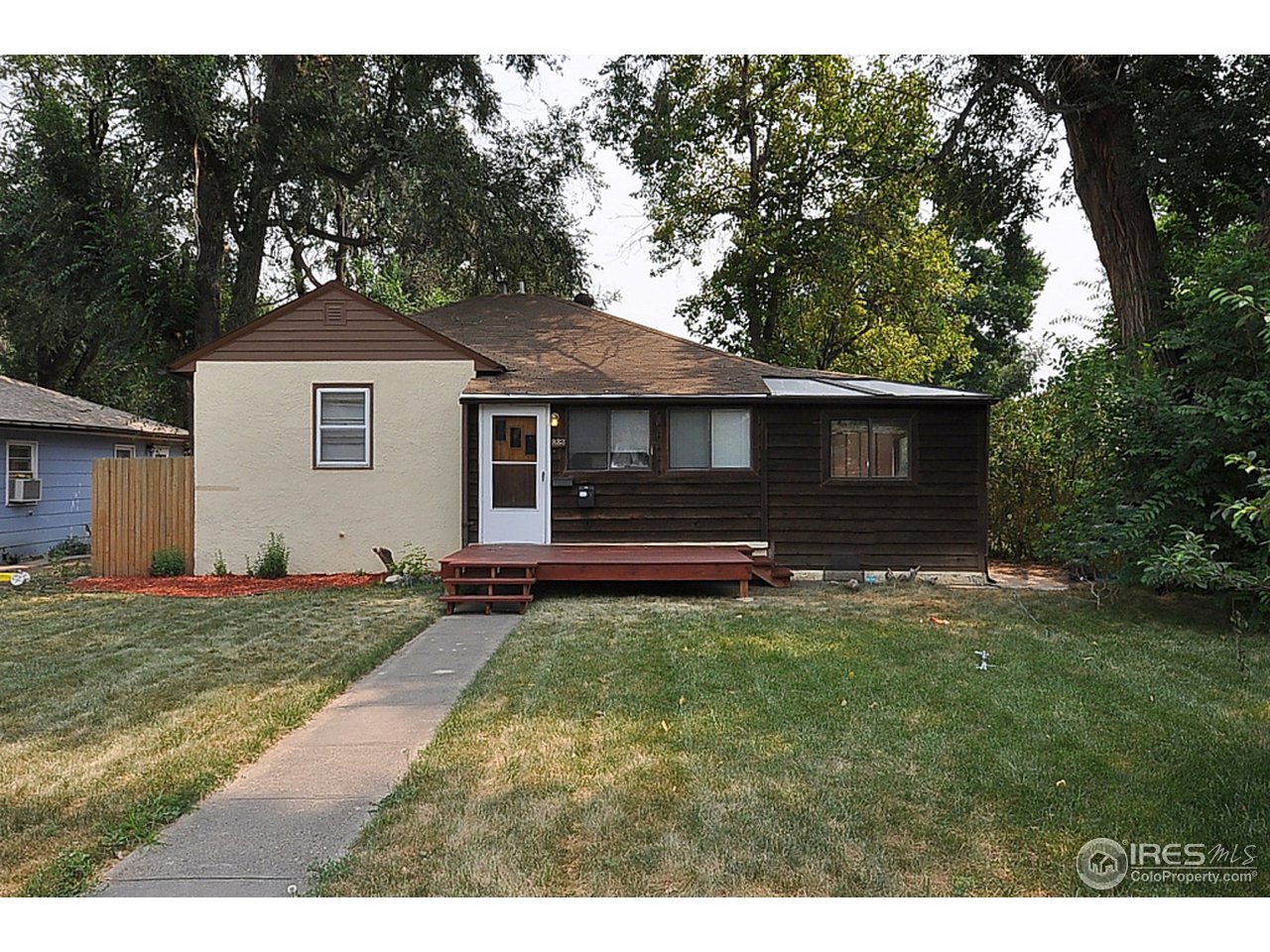 222 North Whitcomb Street Fort Collins, CO 80521 - Photo 1 of 23 a view of a house with a yard