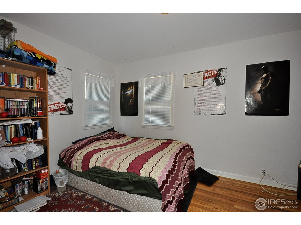 222 North Whitcomb Street Fort Collins, CO 80521 - Photo 13 of 23 a bedroom with a bed a dresser and book shelf